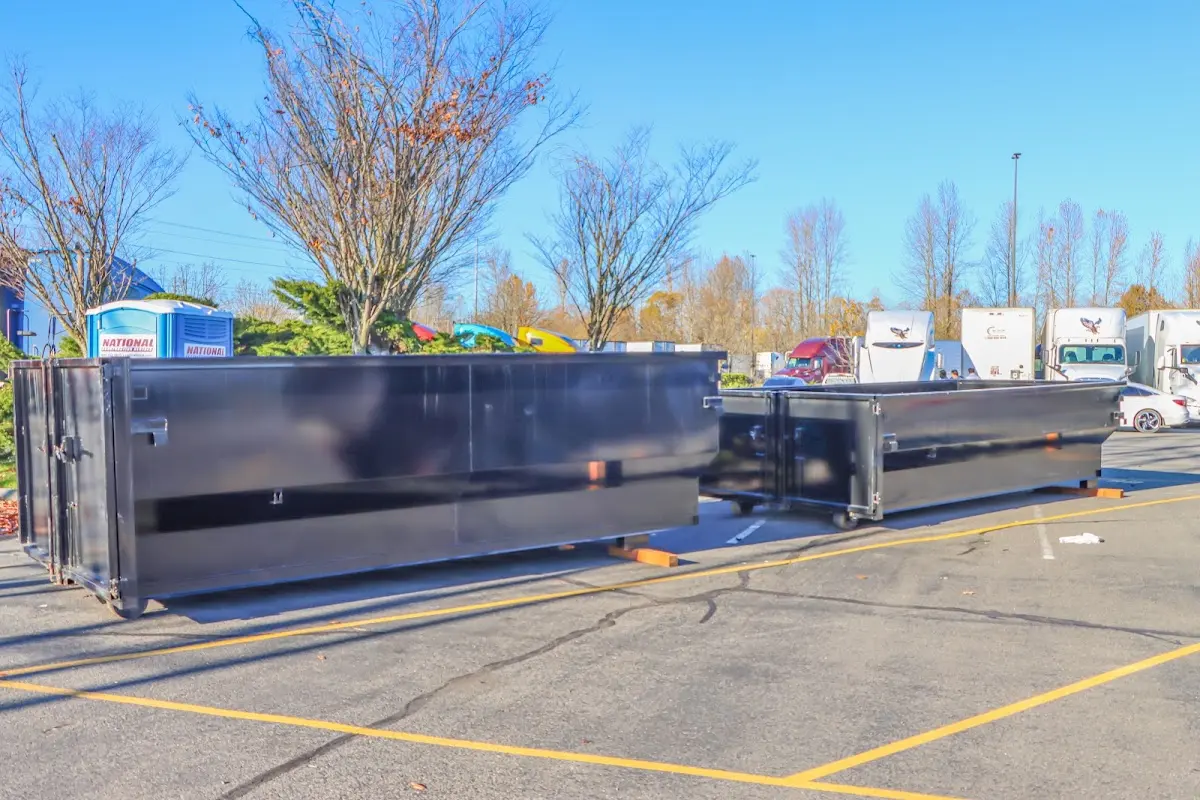 Professional dumpster rental service with roll-off container on residential driveway in Rancho Mission Viejo